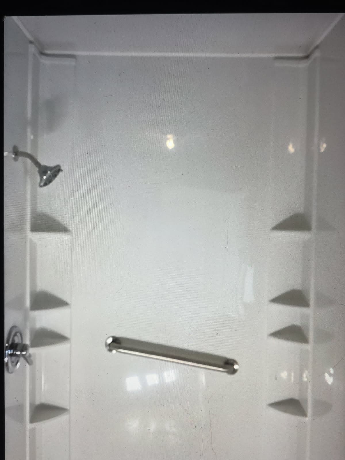 Residential plumber in Evansville, IN — one-piece shower stall with chrome valve and grab bar