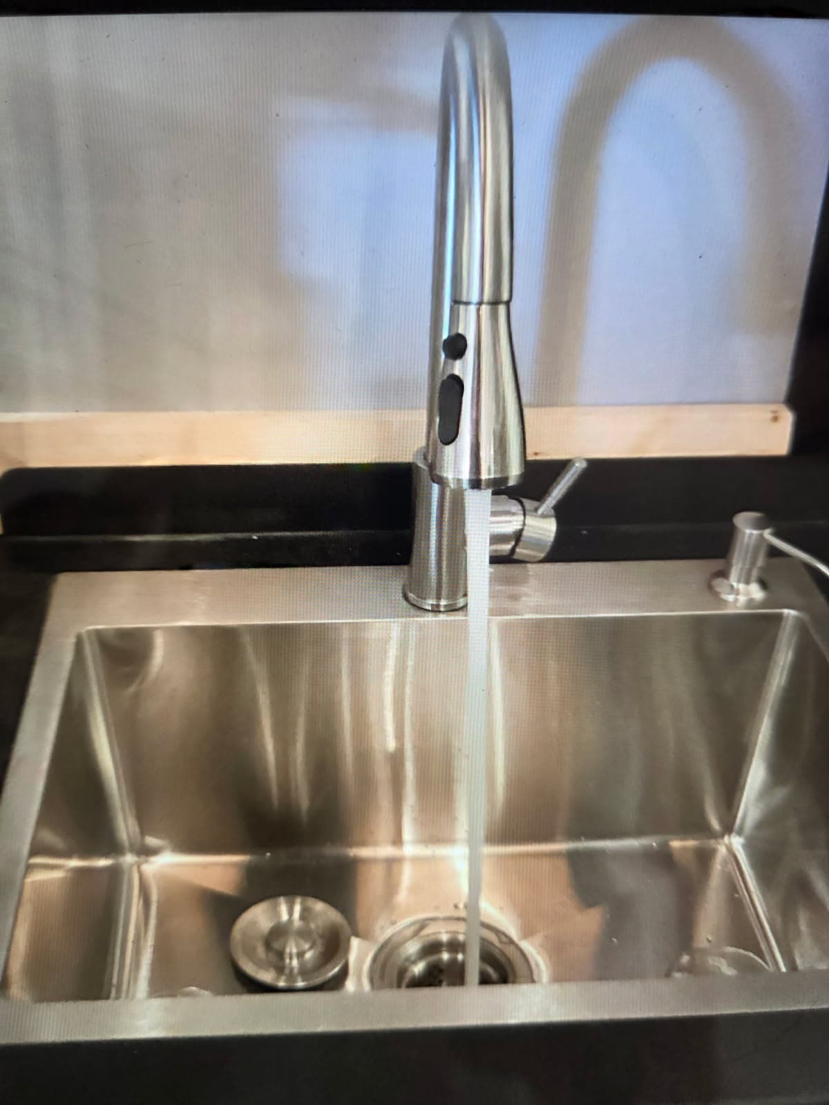 Plumber in Evansville, IN — kitchen faucet install on a stainless sink